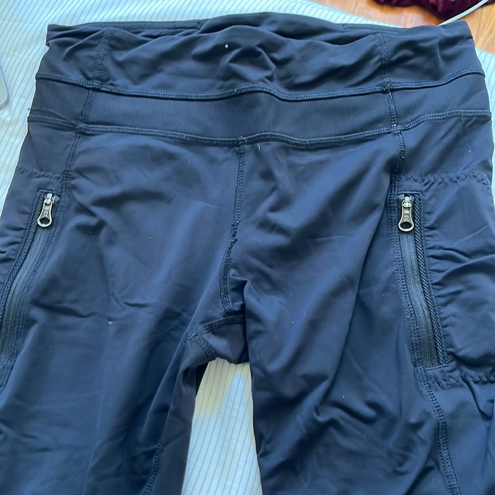 Lululemon size 6 black leggings with zippers and mesh on legs